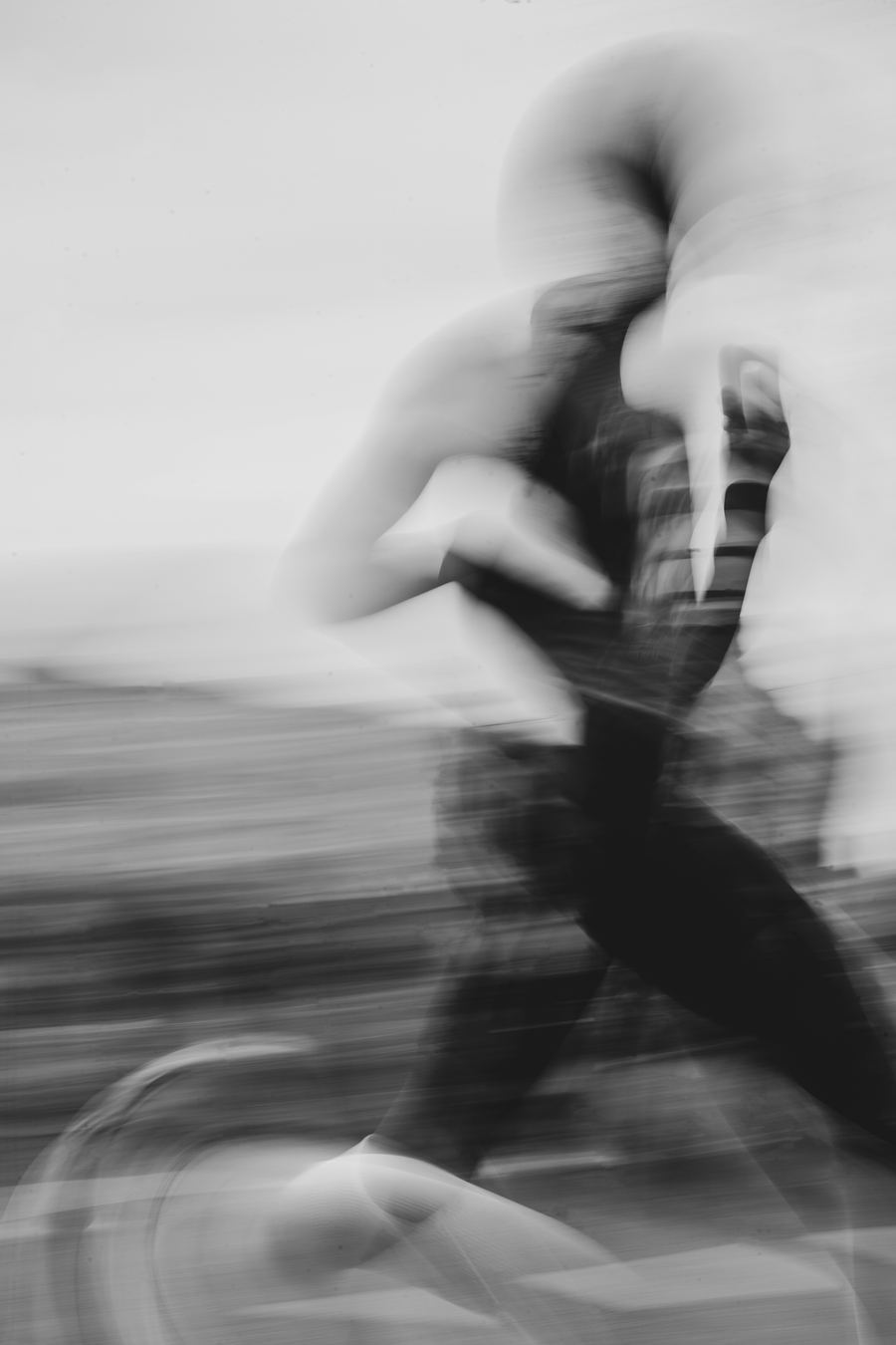 A runner in motion blur, in black and white